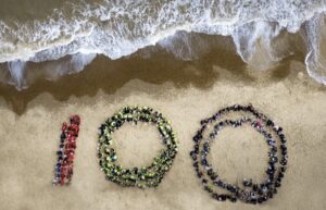 Children formed the numbers 100 to celebrate the birthday of Sir David Attenborough on Felixstowe beach (Image: Alan Boyle)
